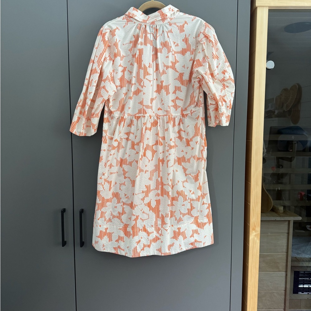 Lee Matthew’s seersucker printed mini dress with puff sleeves and collar.
